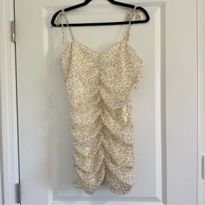 White ruched mini dress with tie straps and lemons